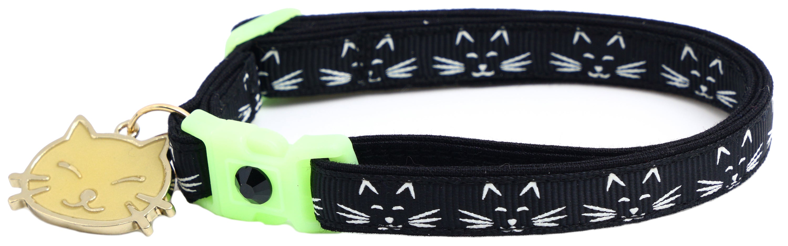 A glowing cat faces breakaway collar made of reinforced cotton, featuring a bell and charm, perfect for nighttime visibility.
